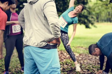 Group of diverse athlete are stretching their muscle