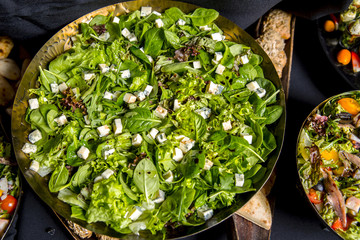Healthy salad with lettuce, spinach, arugula, olive oil