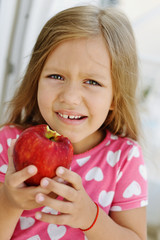 little girl with apple