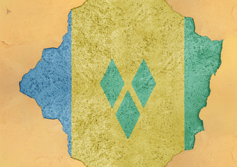 Saint Vincent and the Grenadines flag in big concrete cracked hole and broken material facade...