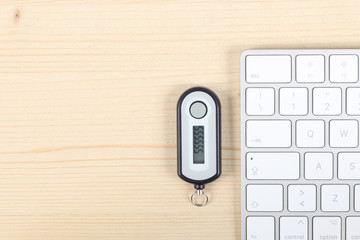 home banking password generator on a wooden desk, a computer keyboard with copy space for your text