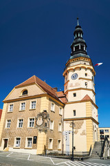 the town hall with clock tower and market in Otmuchow.
