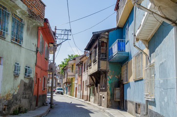Fototapeta na wymiar Beautiful old street in downtown with houses with wooden shutters in the classic Turkish Ottoman style,Afyon in Turkey,