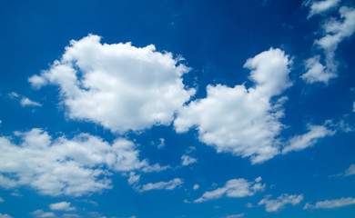 Obraz premium white fluffy clouds in the blue sky