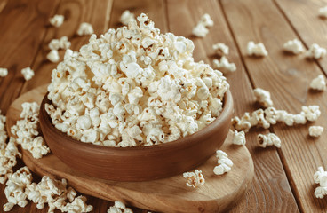 Salt popcorn on the wooden table