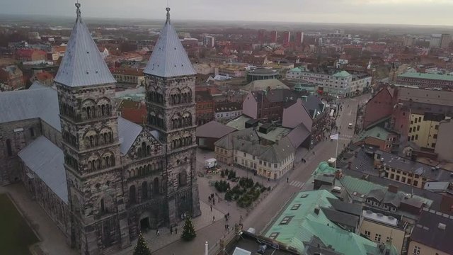 Drone shot of Lund Cathedral building in central Lund city, Sweden. Aerial view of church towers and city street