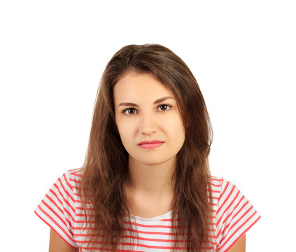 Young serious angry woman in shirt portrait. emotional girl isolated on white background