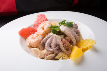 Seafood salad served with grapefruit