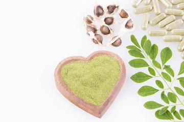 Seeds, leaves, powder and moringa capsules. Top view - Moringa oleifera