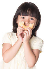 Cute kid girl eating sweet donuts