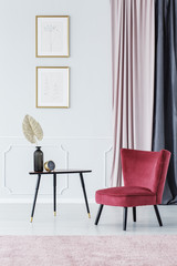 Burgundy chair by the table