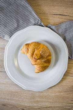Italian cornetto on plate, serviette