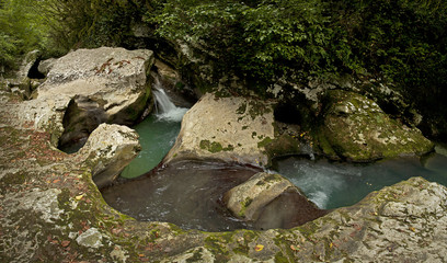 Naklejka na ściany i meble Gorge with a mountain river in the wild.