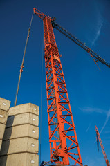 Close-up of crane in a construction area at sunset and blue sky in Tielt. Charming and quiet...