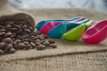 Dark roasted coffee beans on hessian or burlap