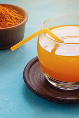 A warm drink from turmeric, lemon and honey for better health. Immunostimulating natural cocktail. Curcumin