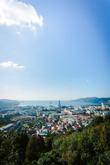 Patong cityscape viewpoint with blue sky in the morning. vertical