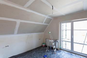 Empty bedroom interior with gypsum board ceiling at renovation
