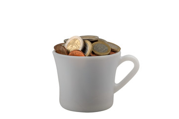 Cup with coins for tips isolated on white background