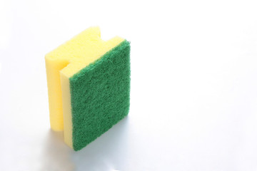 yellow dishwasher sponge isolated on white background