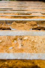 Construction bulldozer tracks full of dirt