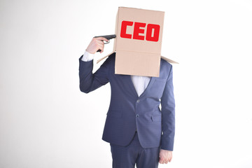 The businessman is holding a box with the inscription:CEO