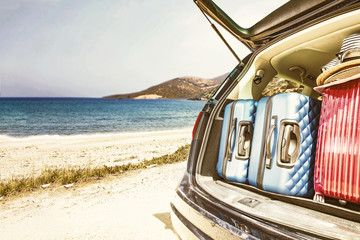 summer car with suitcase and beach landscape 