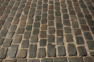 Close-up of stone sidewalk at sunset in the City Center of Ghent. In addition to intense cultural...