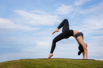 Fototapeta premium yoga girl In the morning time on blue sky background Strengthen the concentration of skin, health and good health is a good exercise