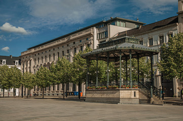Fototapeta premium Square with gazebo, ancient buildings and sunny blue sky in the City Center of Ghent. In addition to intense cultural life, the city is full of Gothic and Flemish style buildings. Northern Belgium.