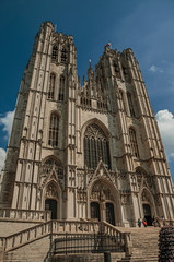 Fototapeta na wymiar Gothic facade of St. Michael and St. Gudula’s Cathedral and blue sunny sky in Brussels. Vibrant and friendly, is the country’s capital and administrative center of the EU. Central Belgium.