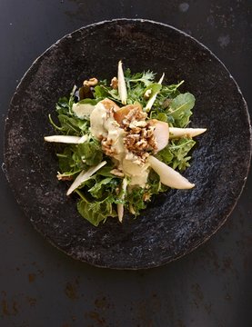 An autumnal salad with pears and walnuts
