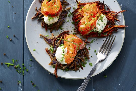Vitelotte R&ouml;sti (fried Swiss potato cakes) with cr&egrave;me fra&icirc;che and salmon