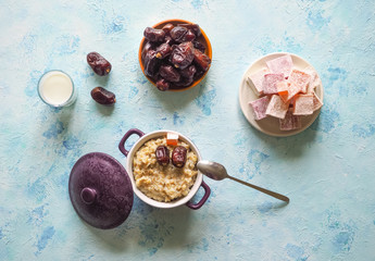 Oatmeal with milk and dates. Healthy natural food. Ramadan menu.
