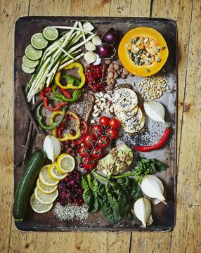 Various vegetables on a vintage tray Healthy greens