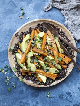 Gluten-free black quinoa salad with avocado and carrot