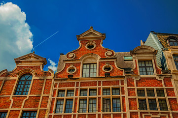 Facade with bricks and window adorned in the region of Flanders style in Brussels. Vibrant and friendly, is the country’s capital and administrative center of the EU. Central Belgium. Retouched photo