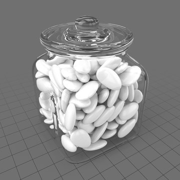 Glass jar filled with oval stones