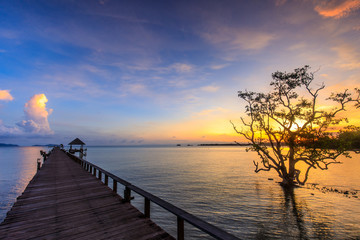 Fototapeta na wymiar Colorful sunset on the bridge of dream at Koh Mak island, Trat province, Thailand.