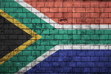 South Africa flag is painted onto an old brick wall