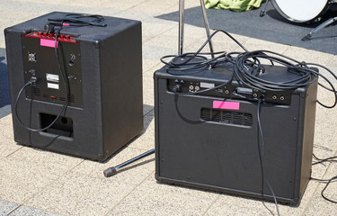 Amplifiers outdoor next to a drum