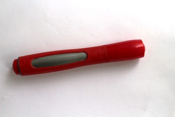 The red marker on white drawing paper