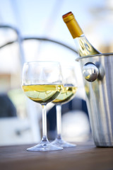 Pair of wineglasses against the yacht
