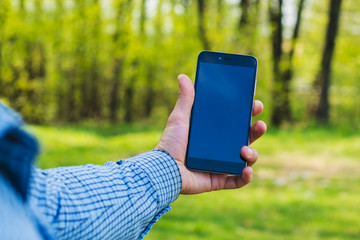 man holding a phone in his hand