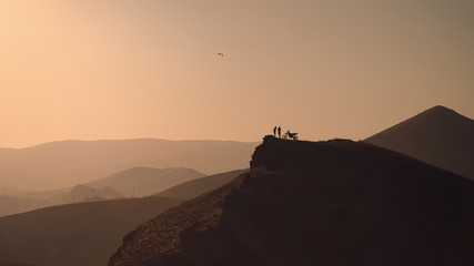 sunset meeting at the top of the mountain