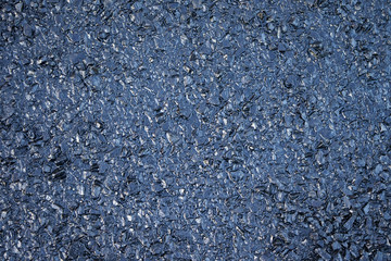 Gravel covered with motor oil.