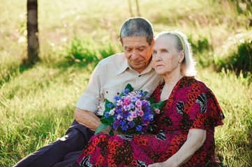 beautiful happy old people sitting in the  park