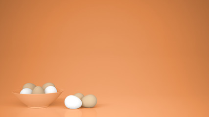Chicken eggs into a orange cup and on the table, orange background with copy space, breakfast easter food concept idea