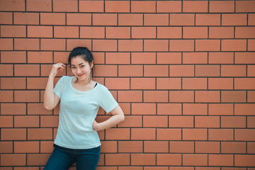 Portrait of beautiful asian chic girl pose for take a picture on brick wall,Lifestyle of teen thailand people,Modern woman happy concept