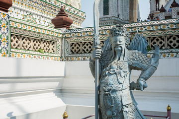 Chinese style sculpture, Giants guard in front of the entrance at "Wat Aroon" temple